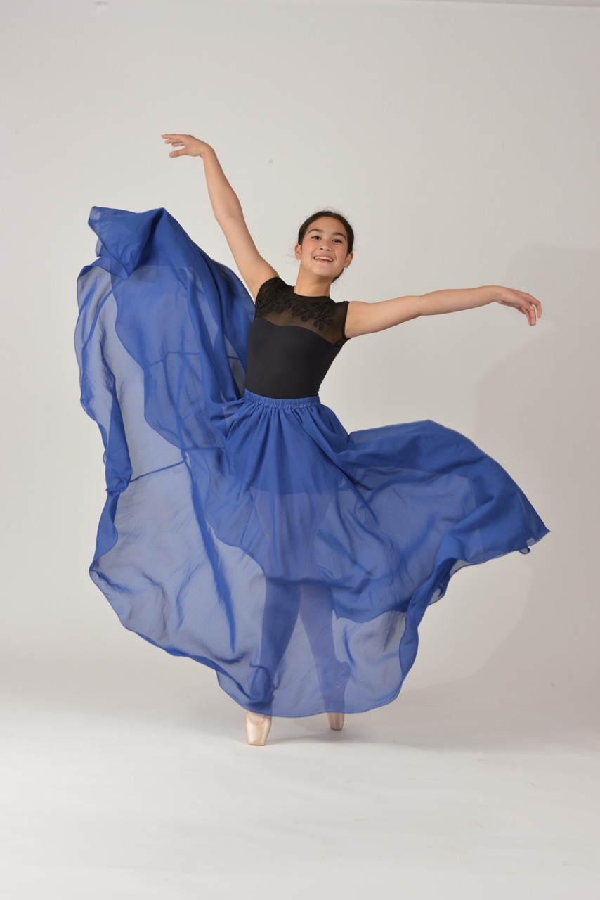 dancer wearing blue standing on her toes