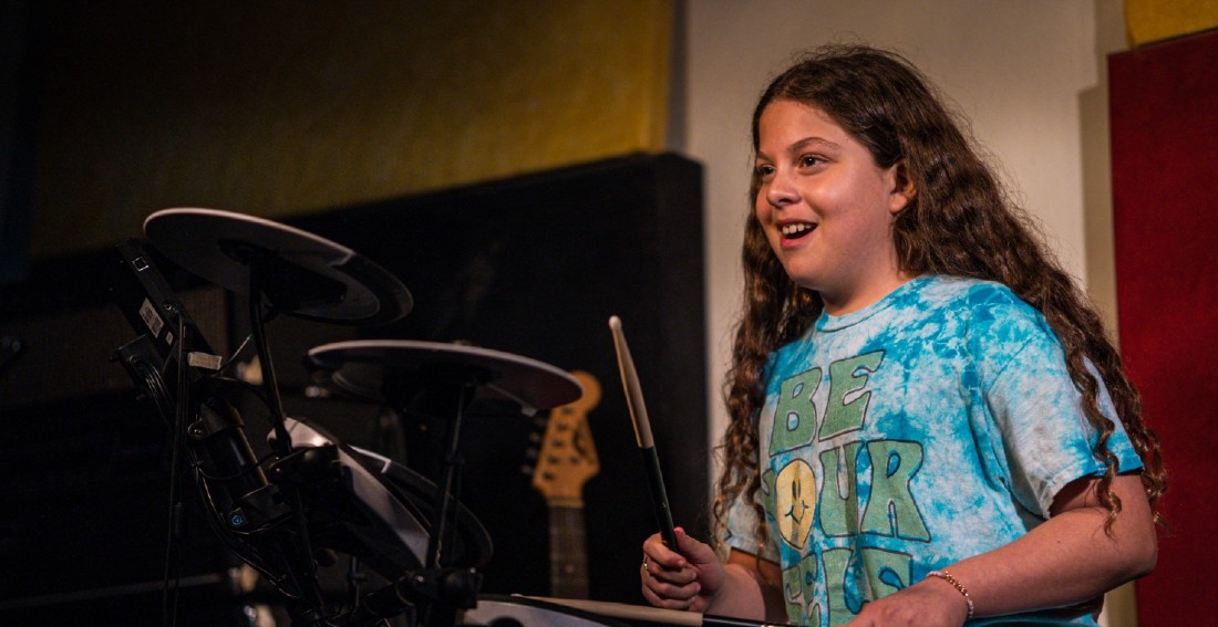 student playing Drums